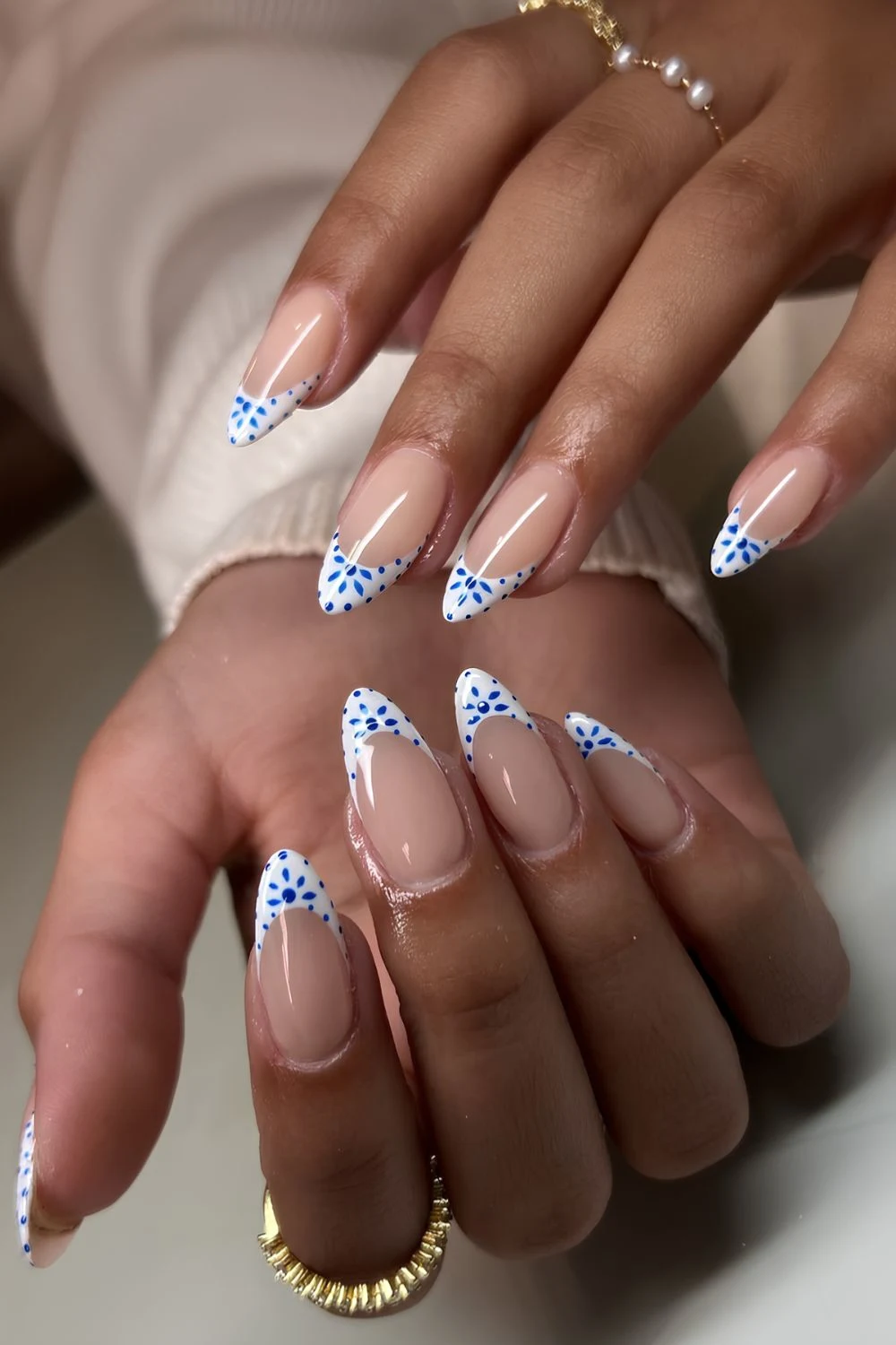White French mani with blue mediterranean flowers