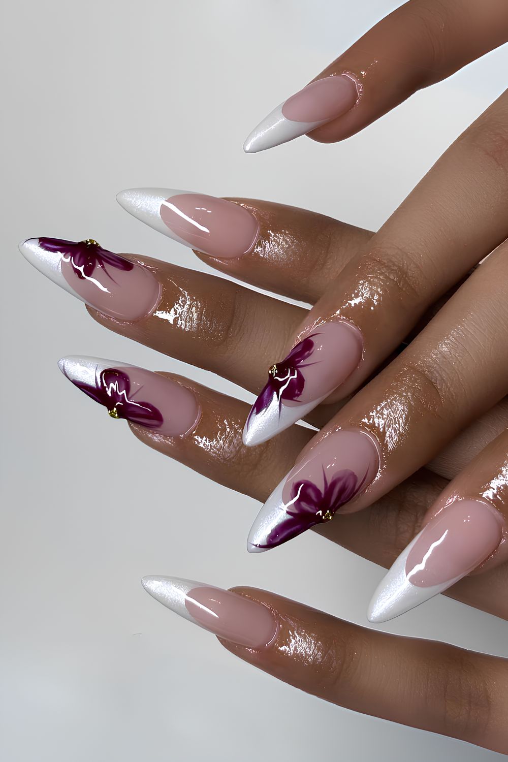 White French nails with oversized red flowers