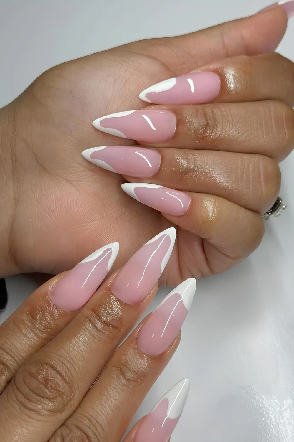 White abstract French mani with sheer pink base