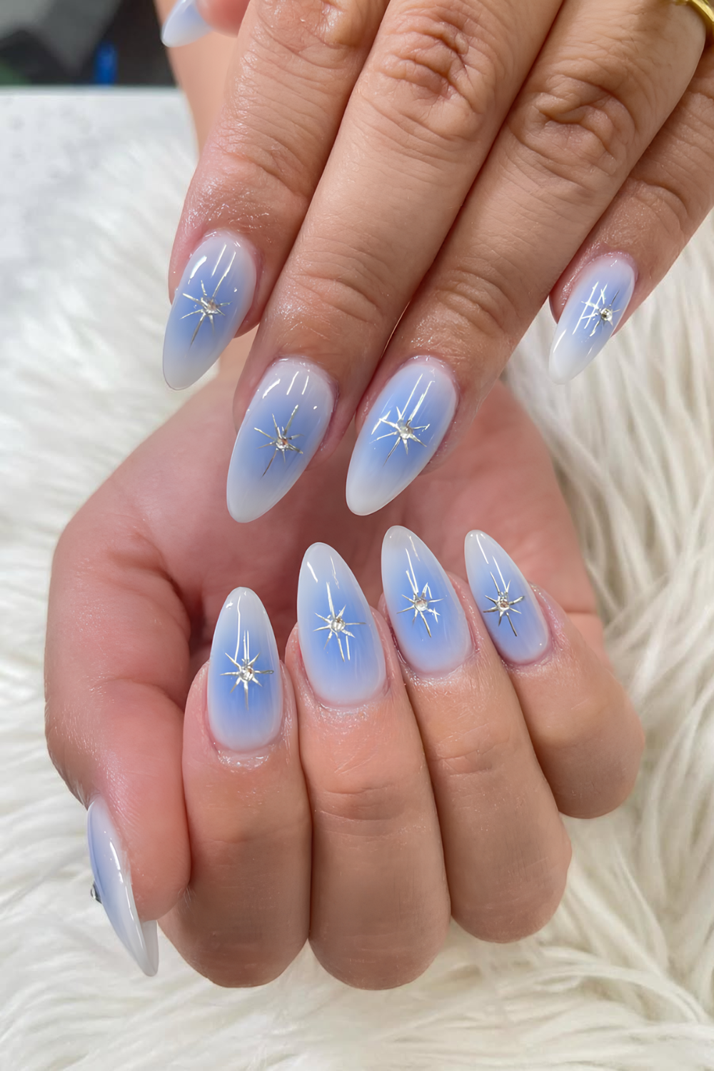 White and blue aura nails with celestial details