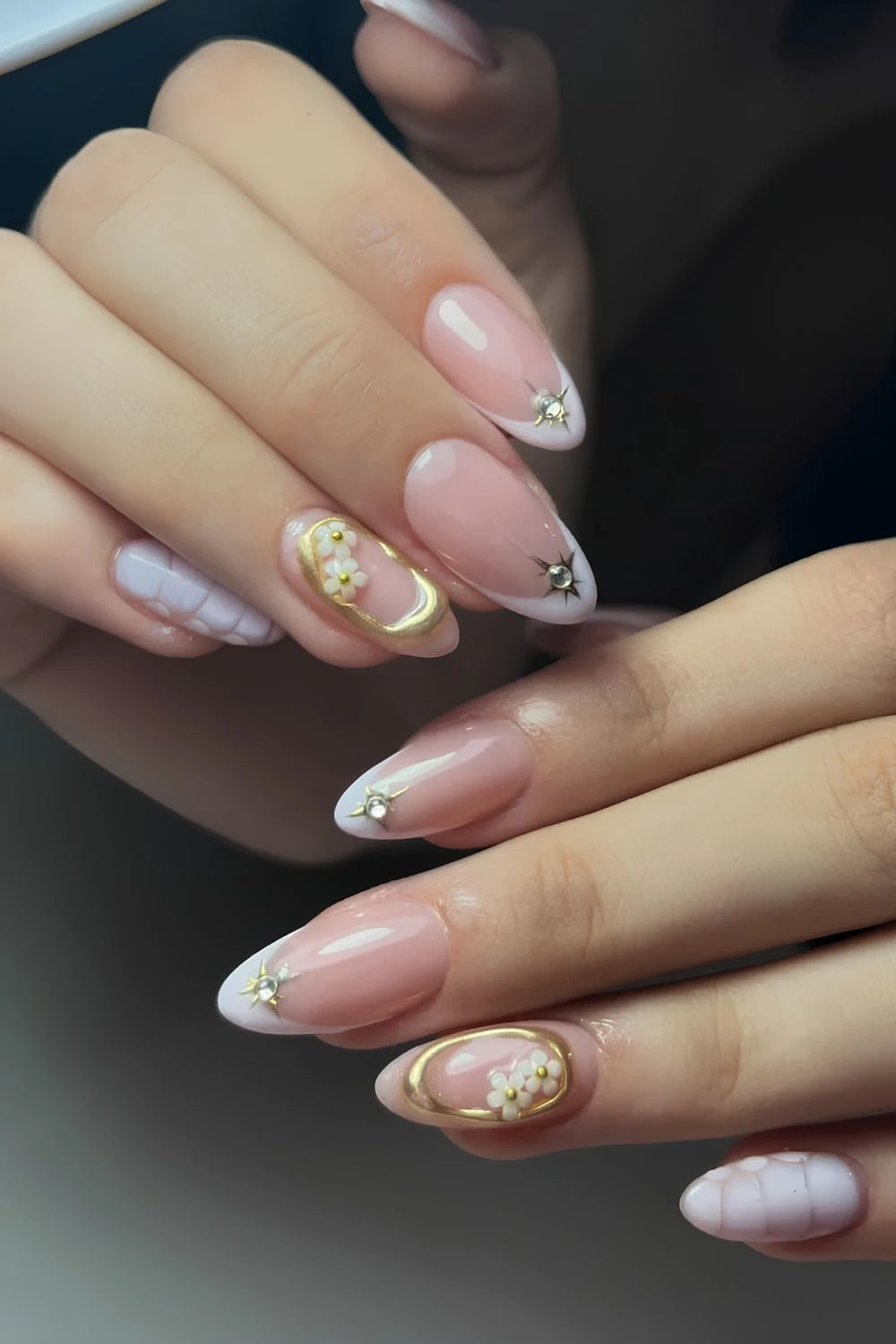 White and gold mix and match mani with florals and animal print