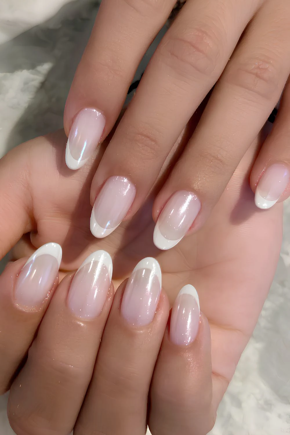 White chrome French mani on a milky base