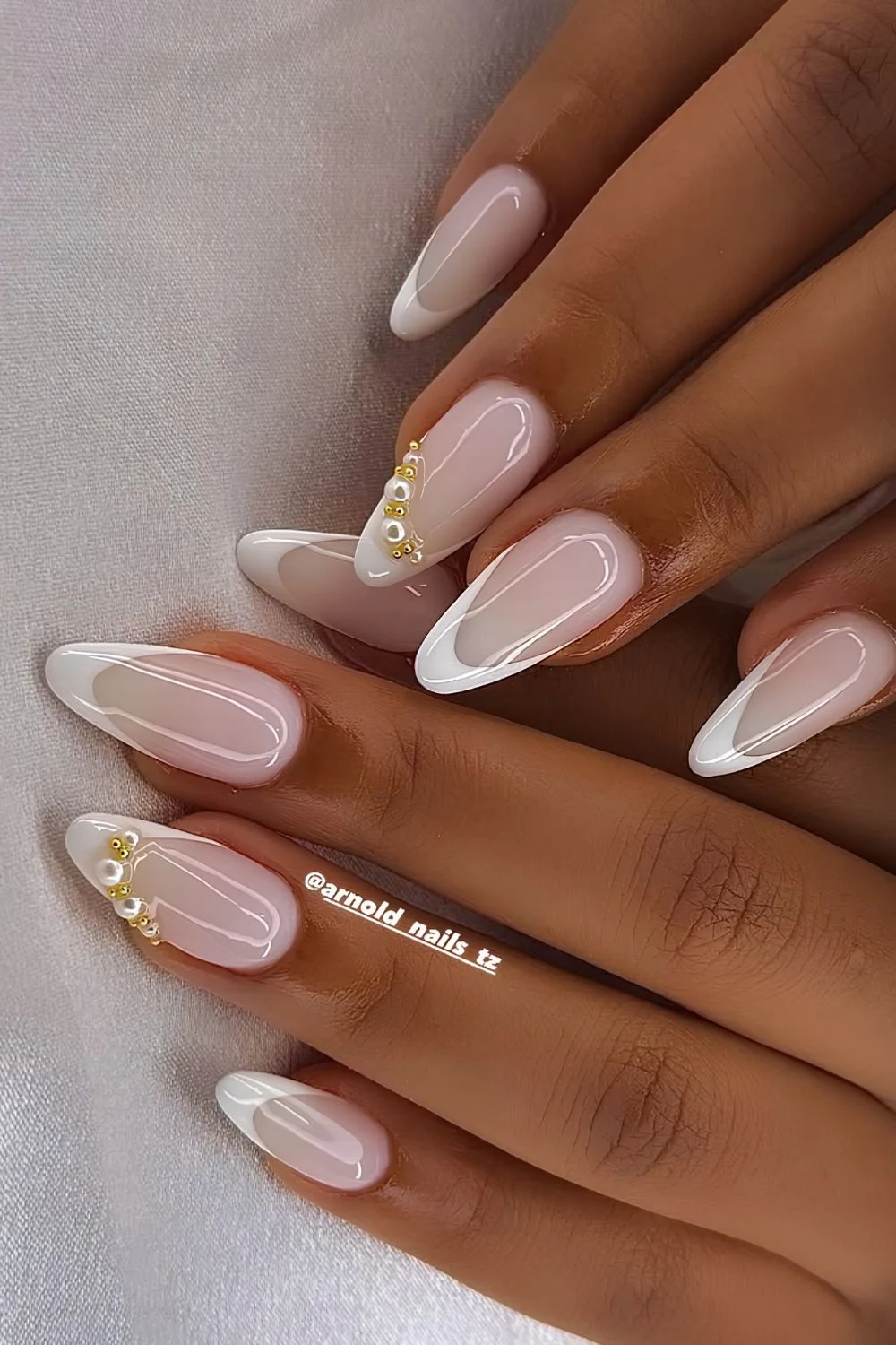 White french on a milky base with pearls