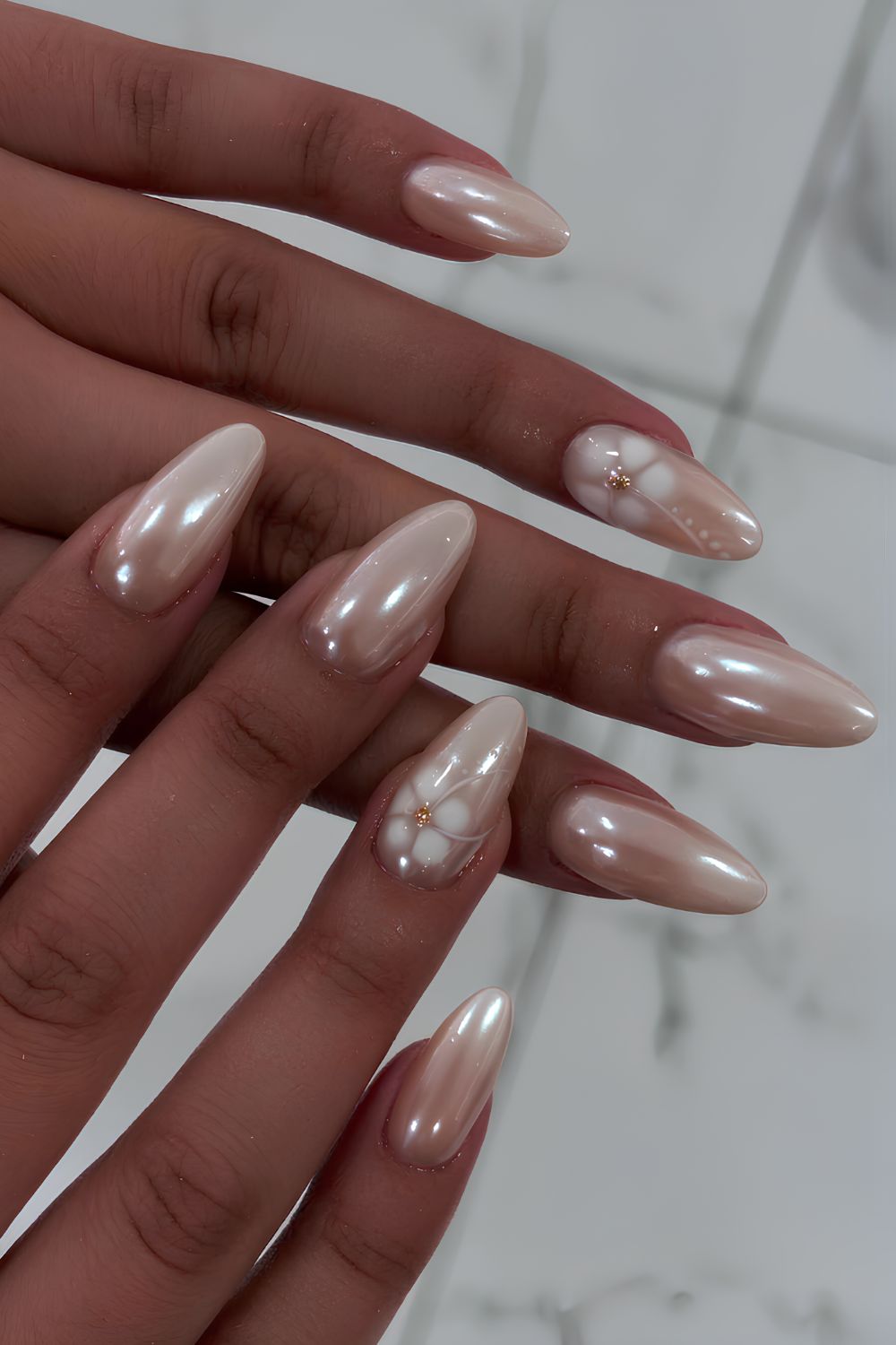 White pearl chrome nails with blooming flowers