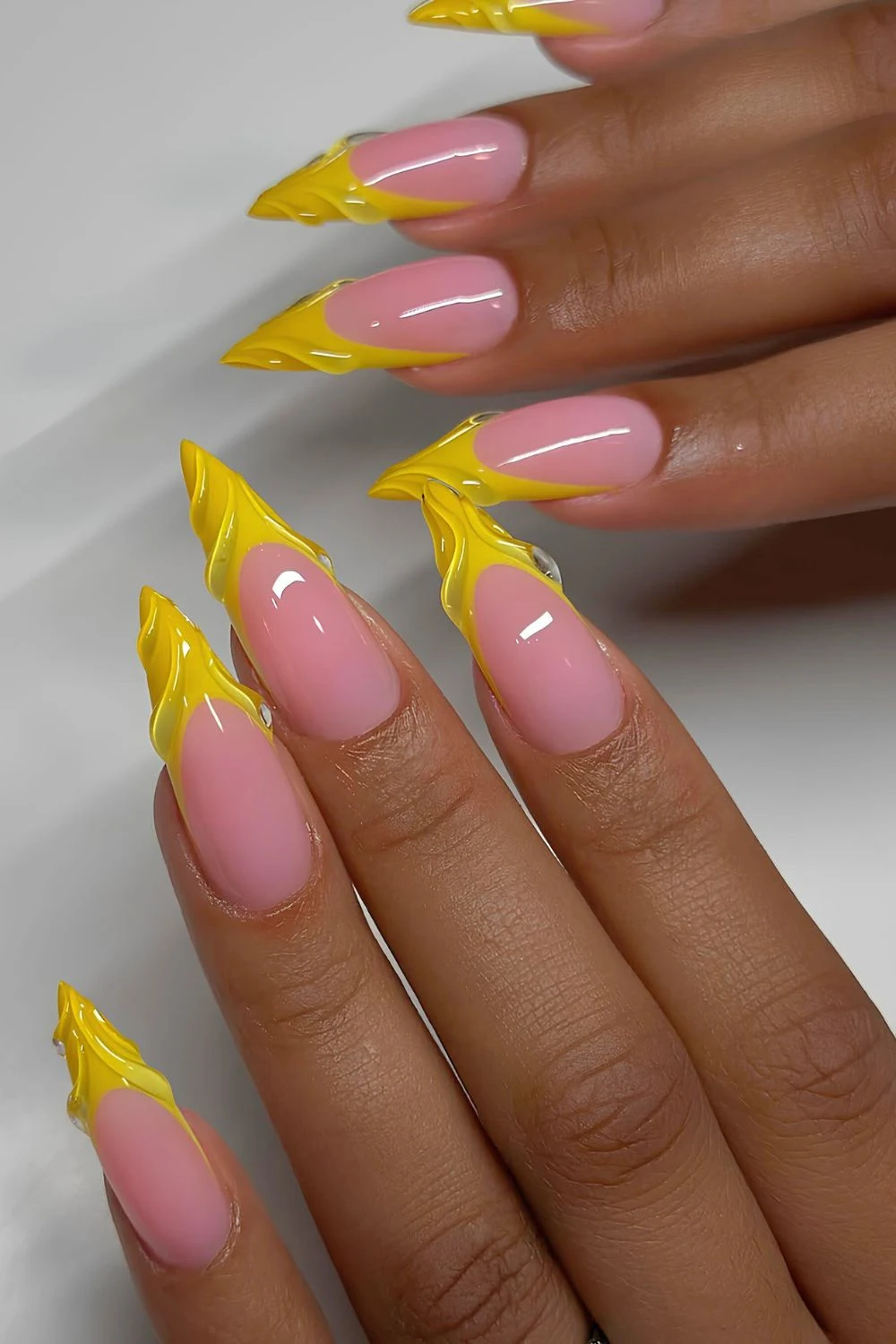 Yellow French nails with textured tips