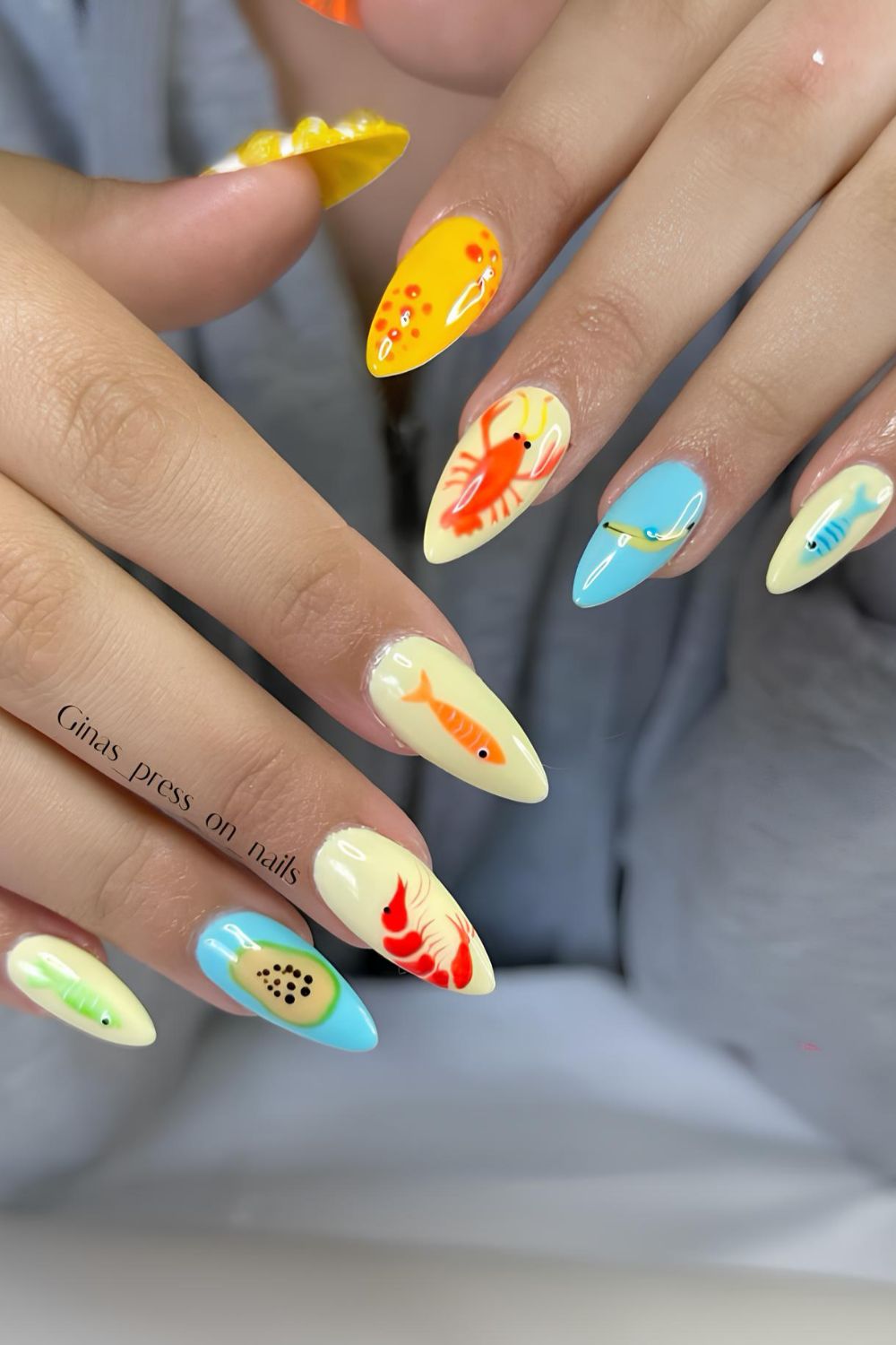 Yellow and blue nails with fishing lure design