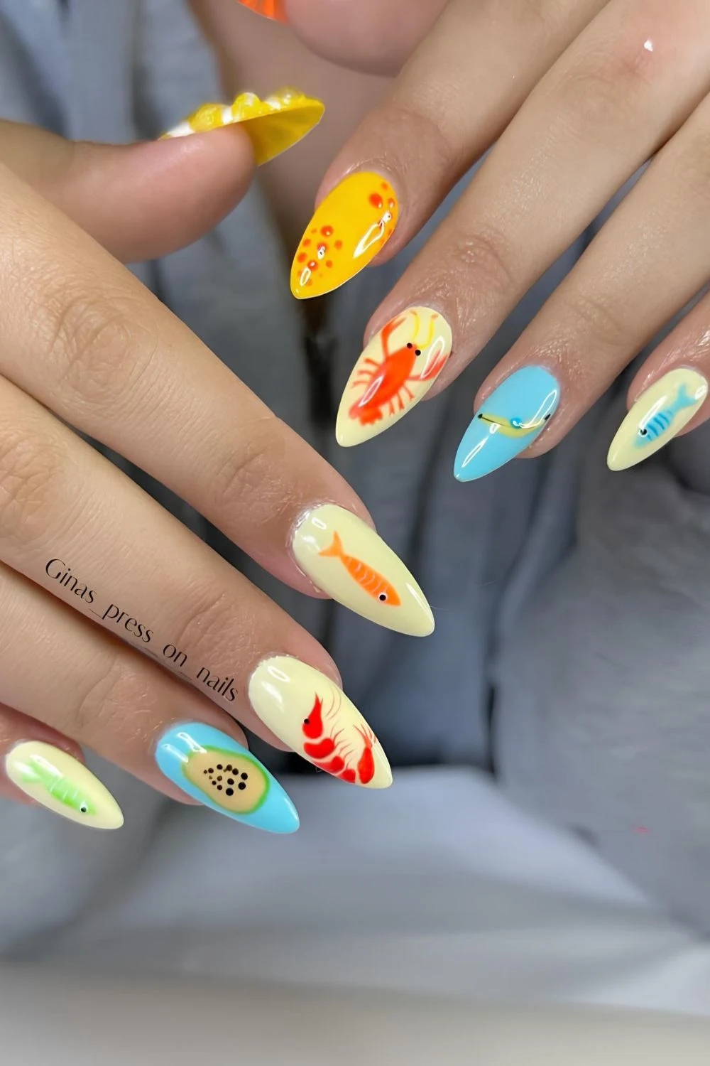 Yellow and blue nails with fishing lure design