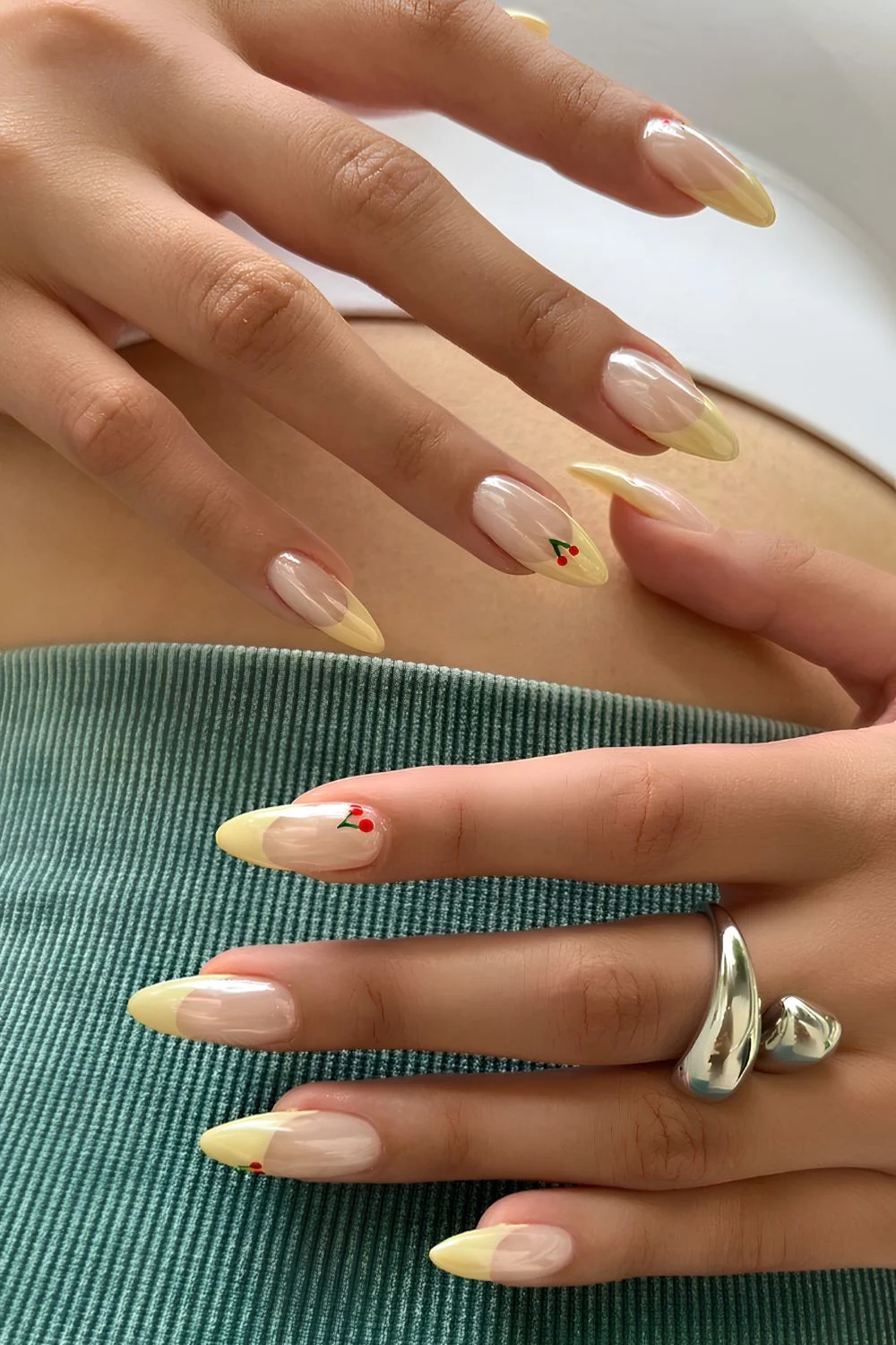 Yellow chrome French nails with cherries