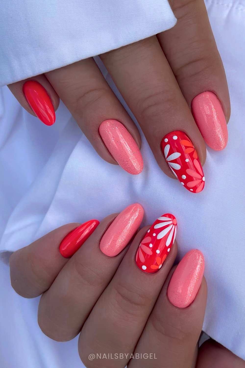 Almond coral nails with shimmer and flowers