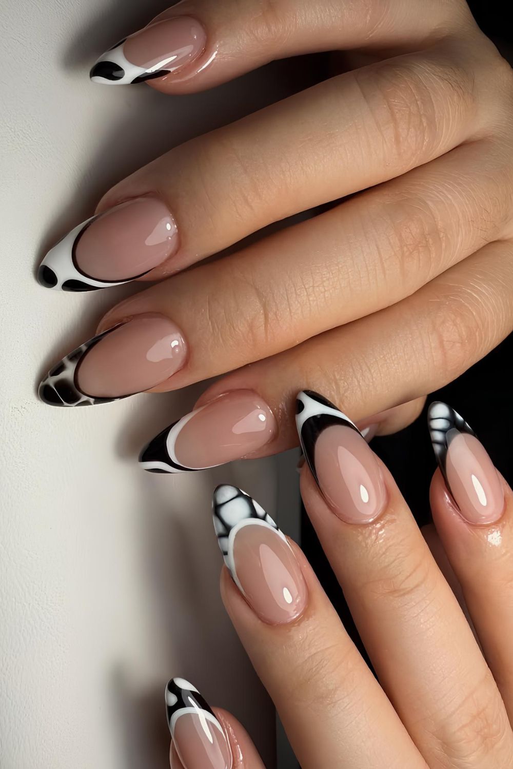 Black and white French mani with geometric design