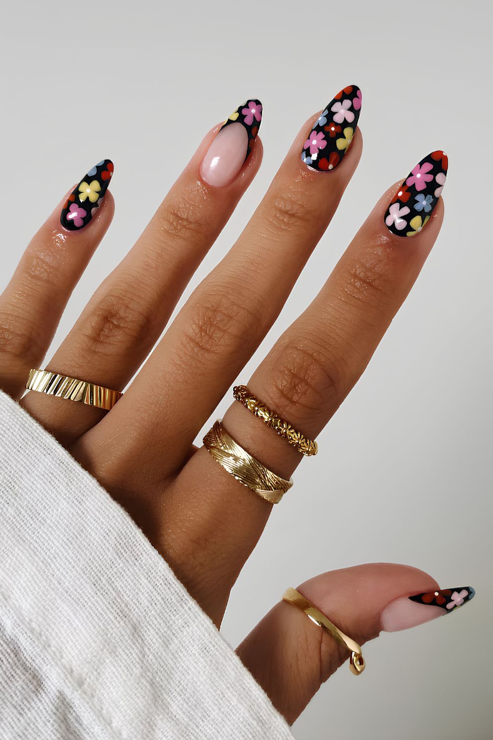 Black nails with colorful floral art