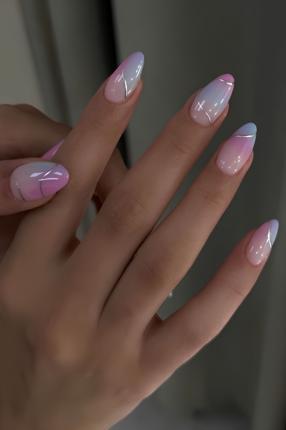 Blue and pink gradient nails with silver accents