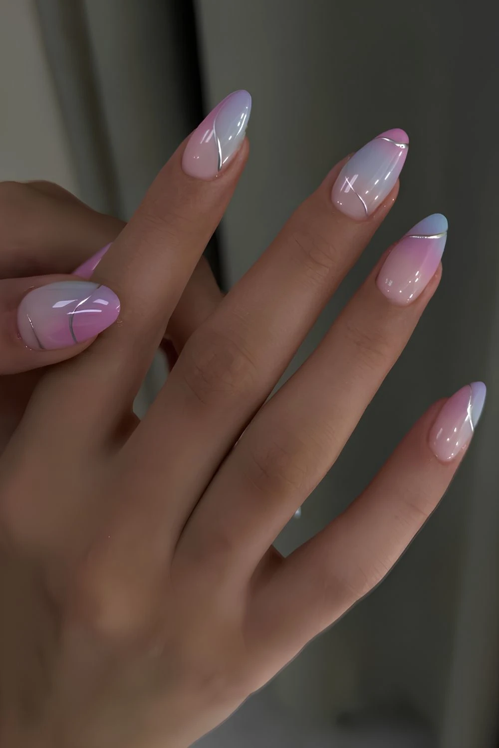 Blue and pink gradient nails with silver accents