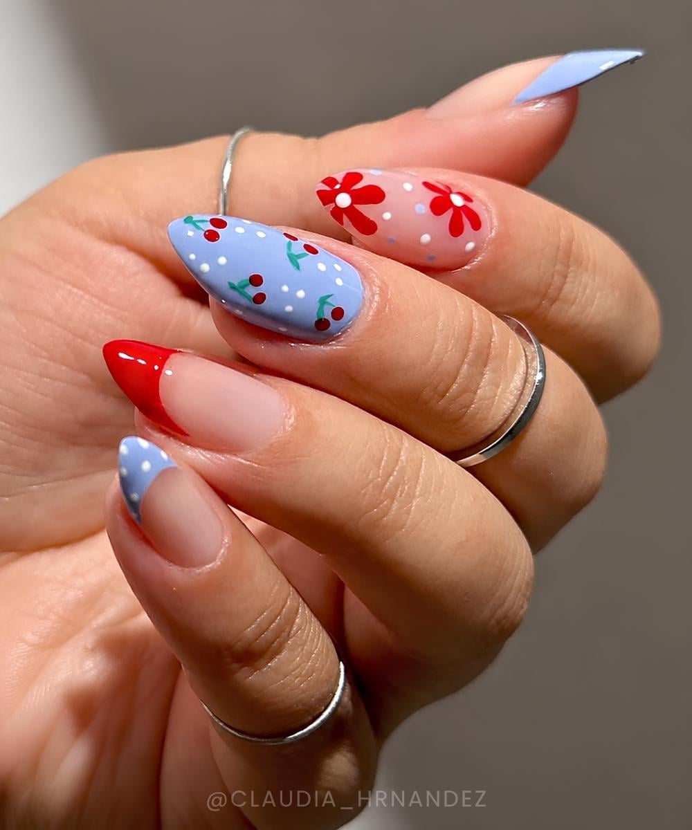 Blue and red nails with cherries and flowers