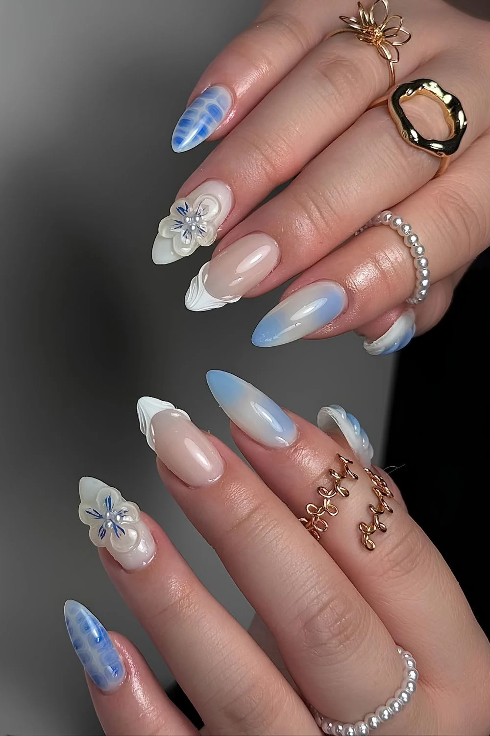 Blue and white mani with sculpted flowers and tips