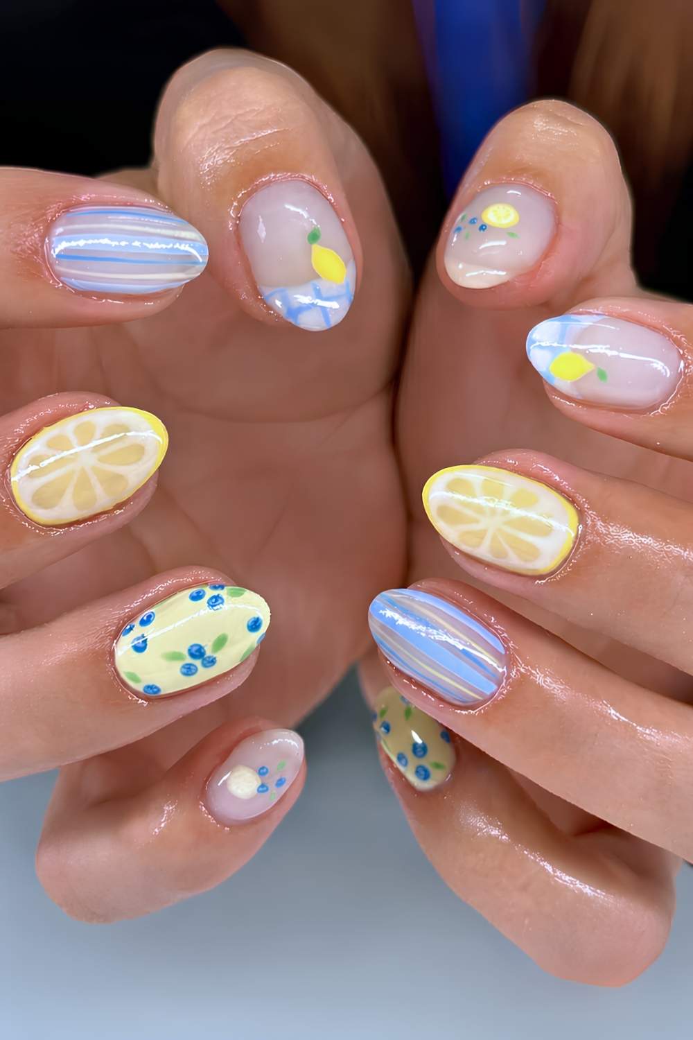 Blue and yellow nails with lemon and gingham art
