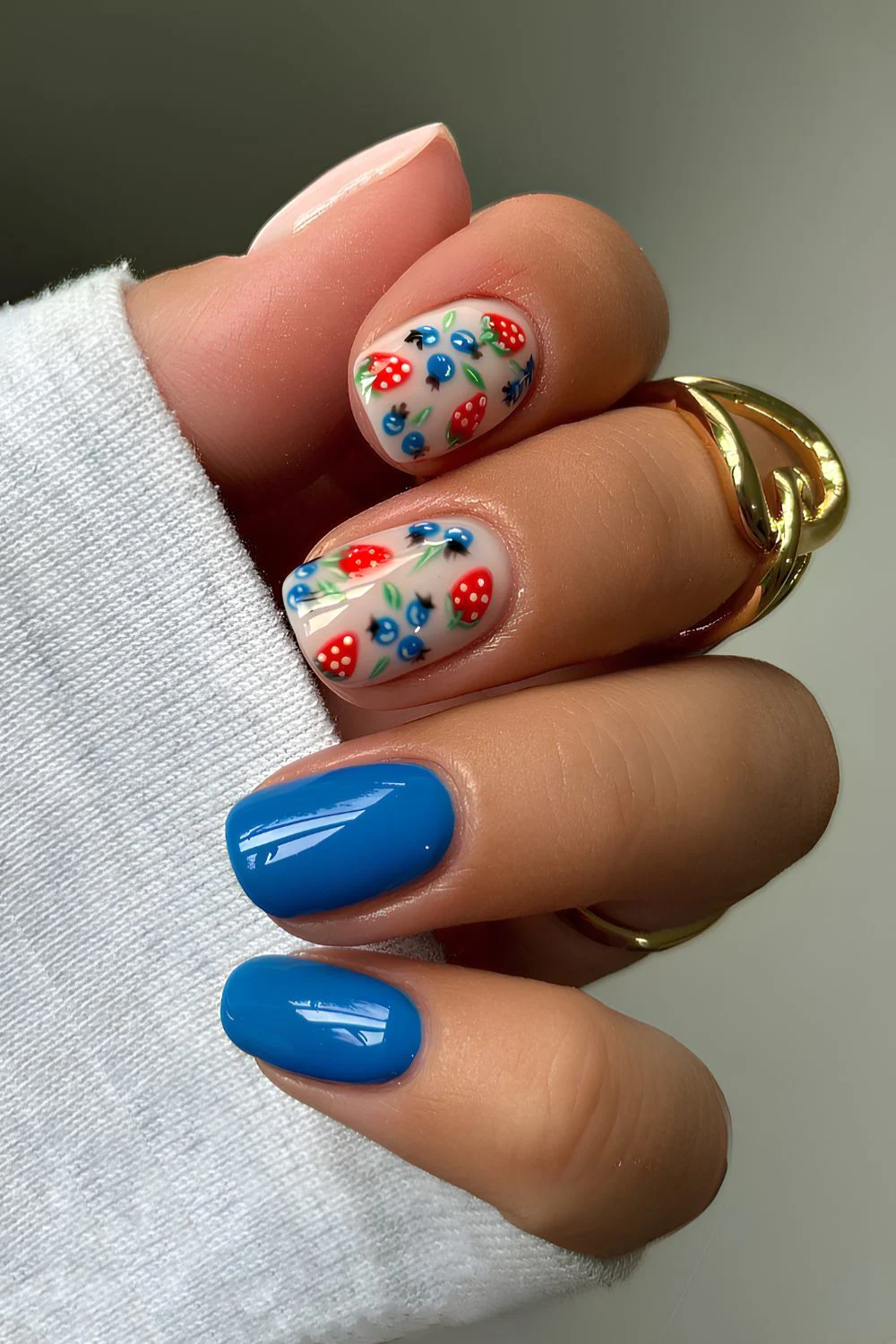 Blue nails with blueberry and strawberry art