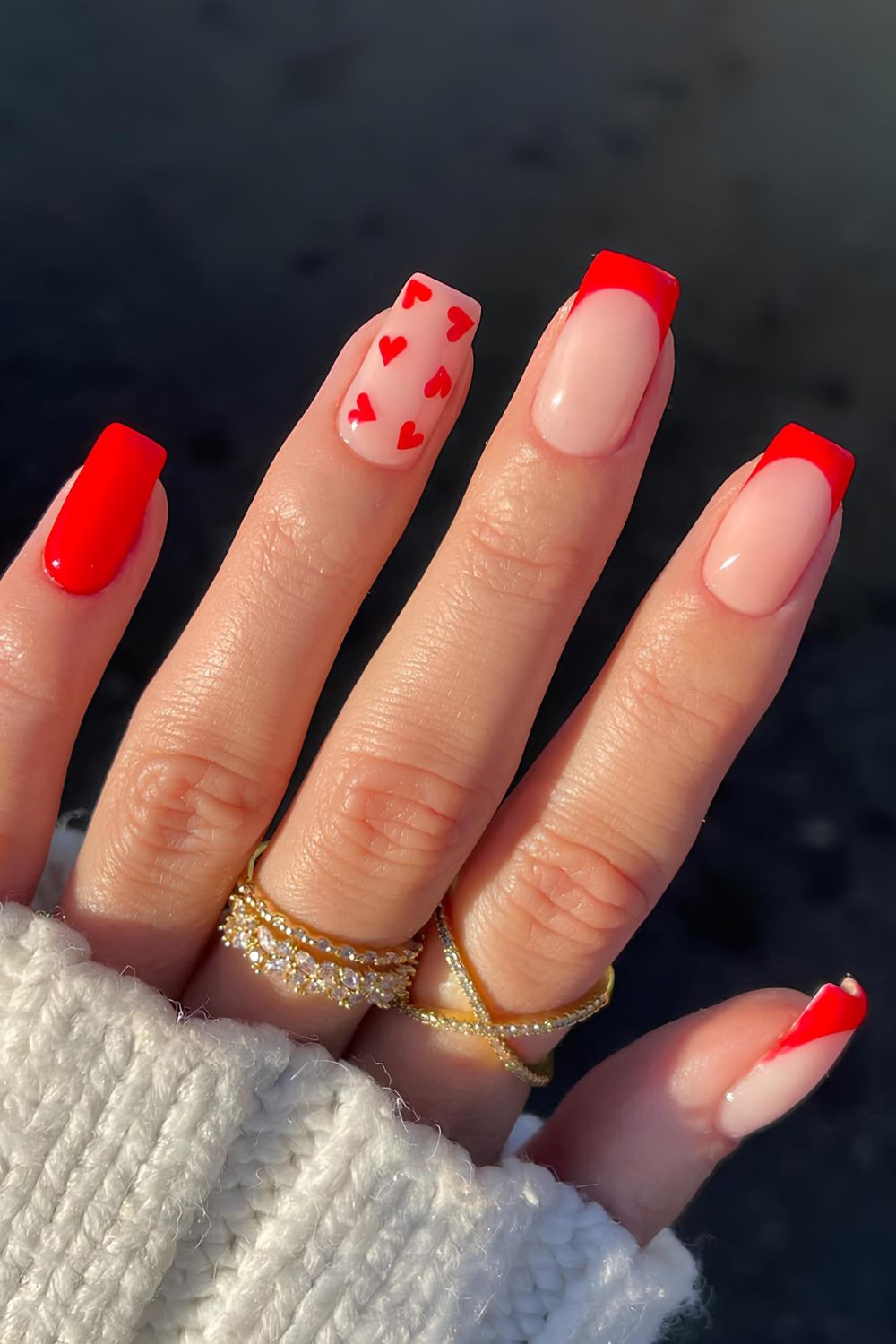 Bright red French mani with heart accents