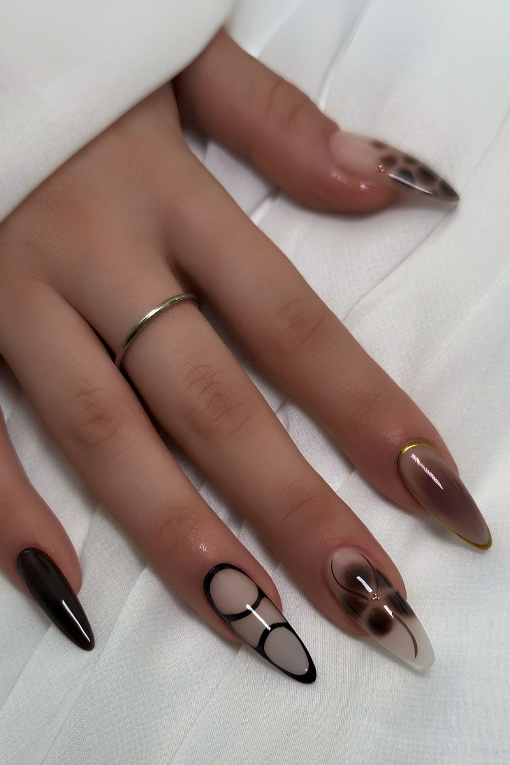 Brown and black nails with blooming gel flowers