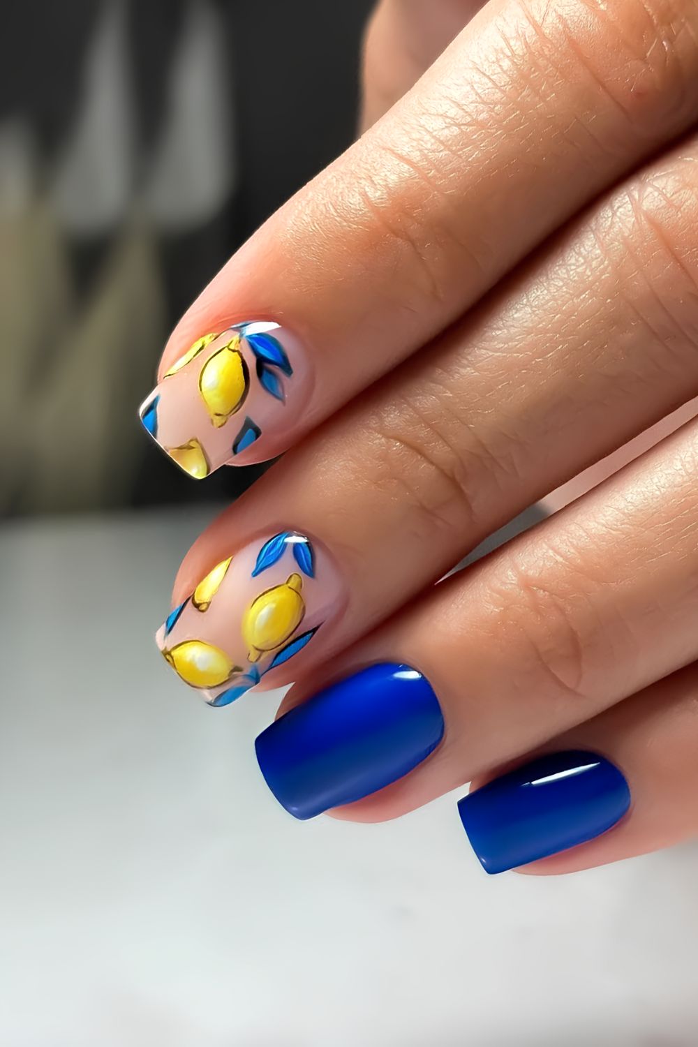 Cobalt blue nails with lemon accents