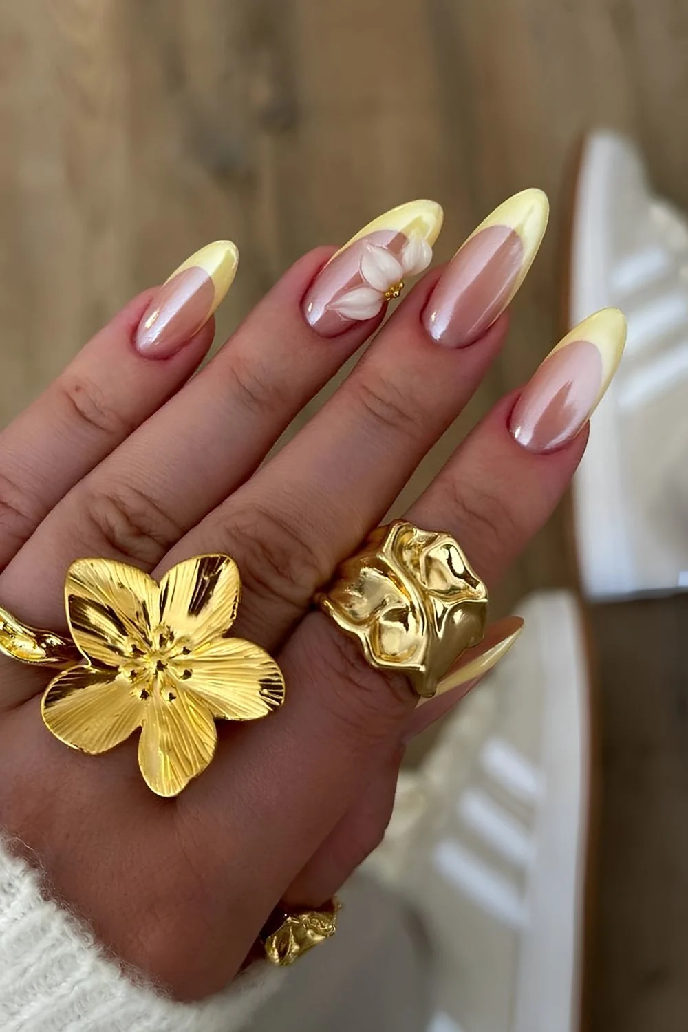 Glazed butter yellow tips with sculpted with sculpted half flower accent