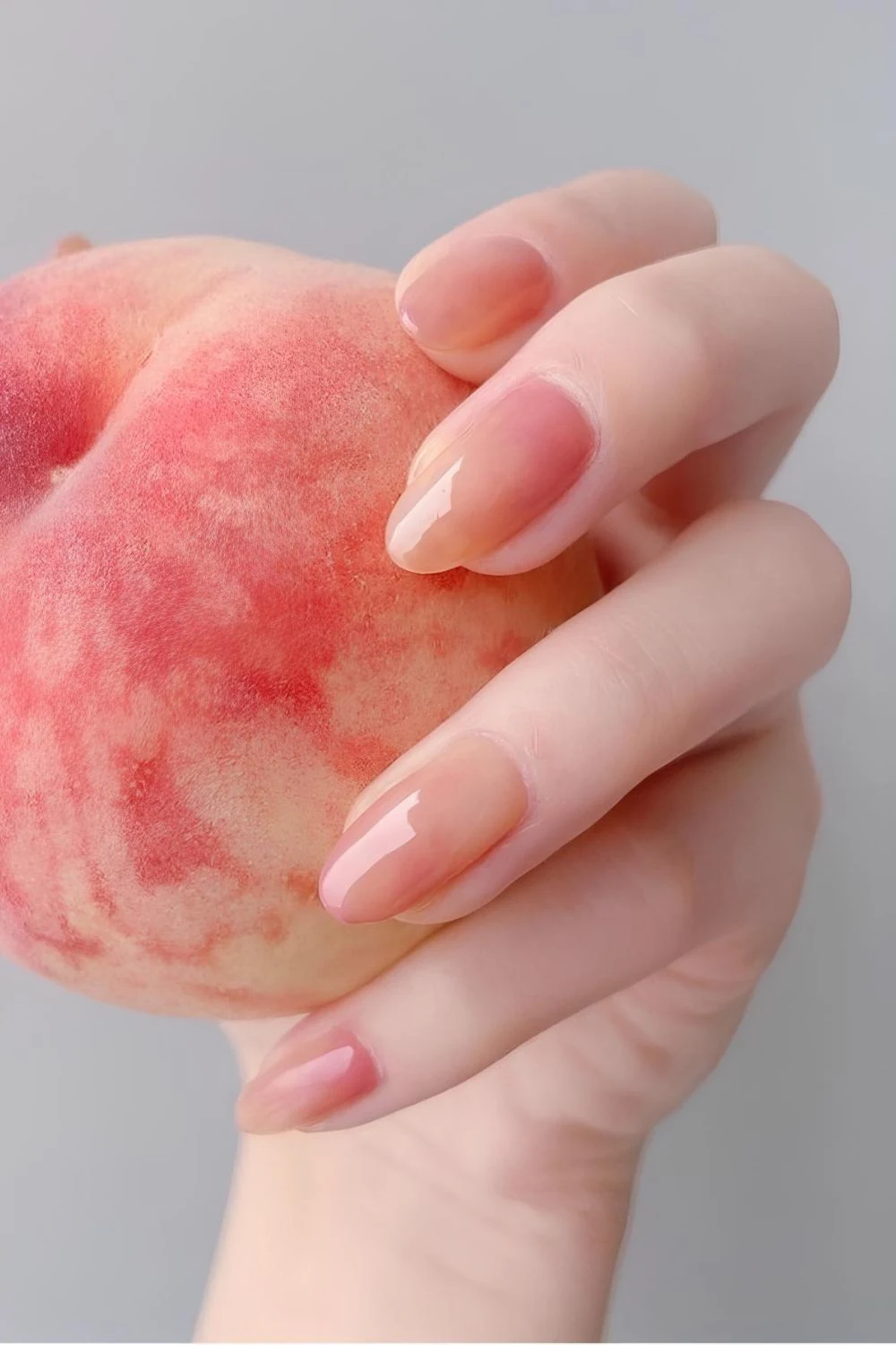 Glossy almond nails inspired by peach skin