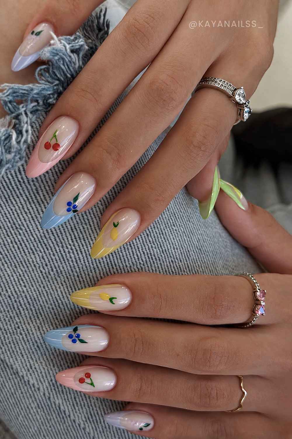 Glossy skittle French nails with micro fruit art