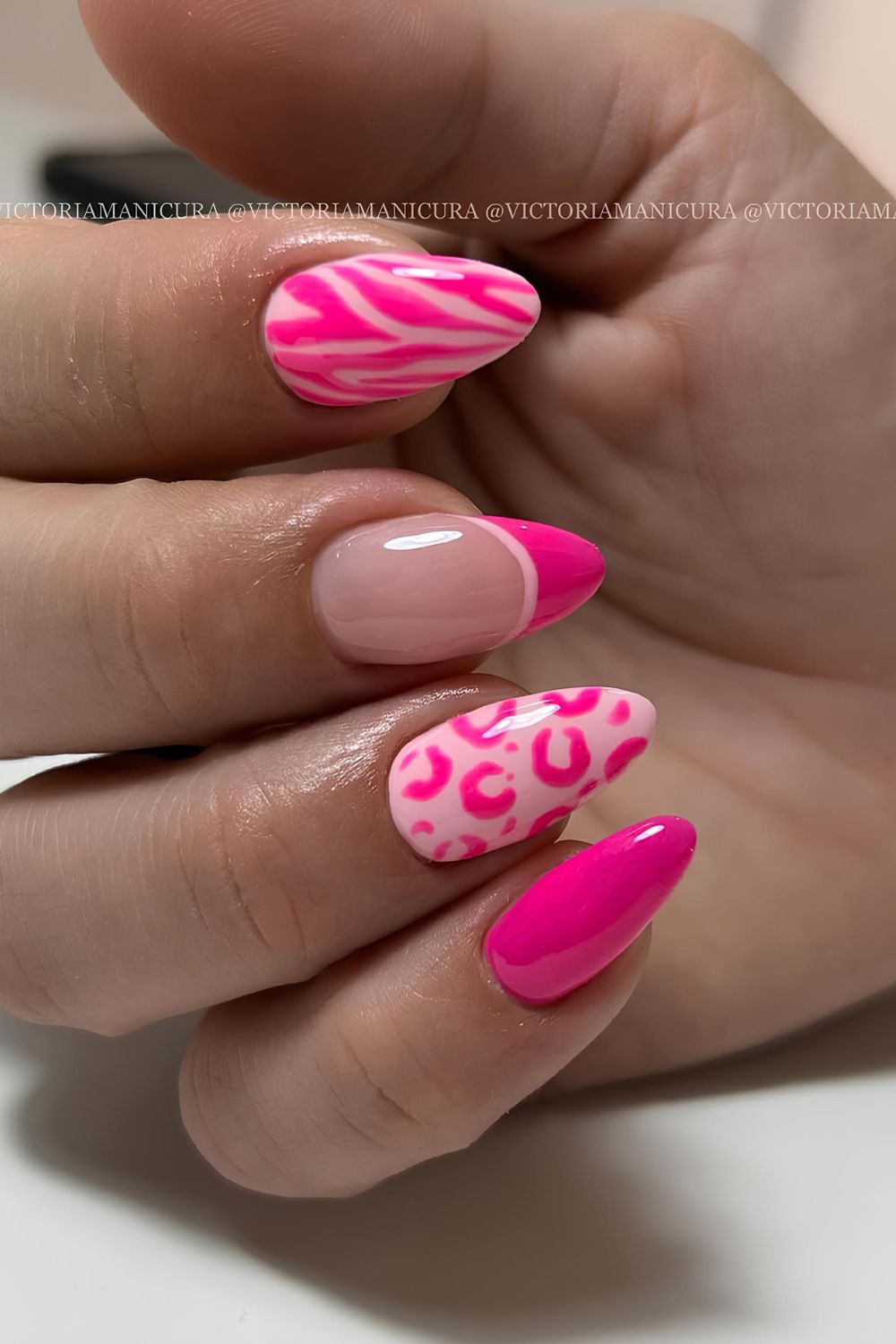 Hot pink mani with animal print desing and a french tip accent
