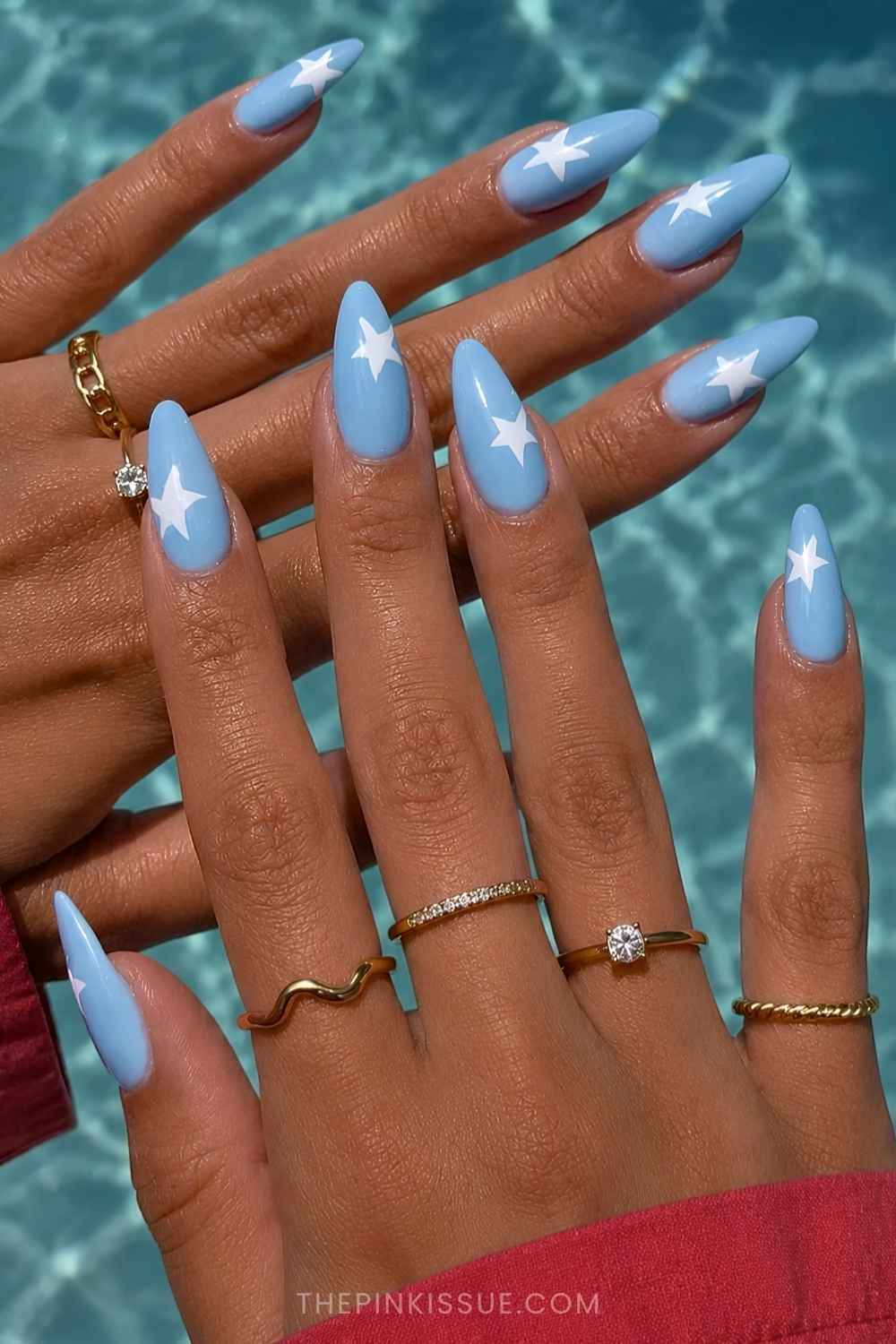 Light blue mani with white star motifs