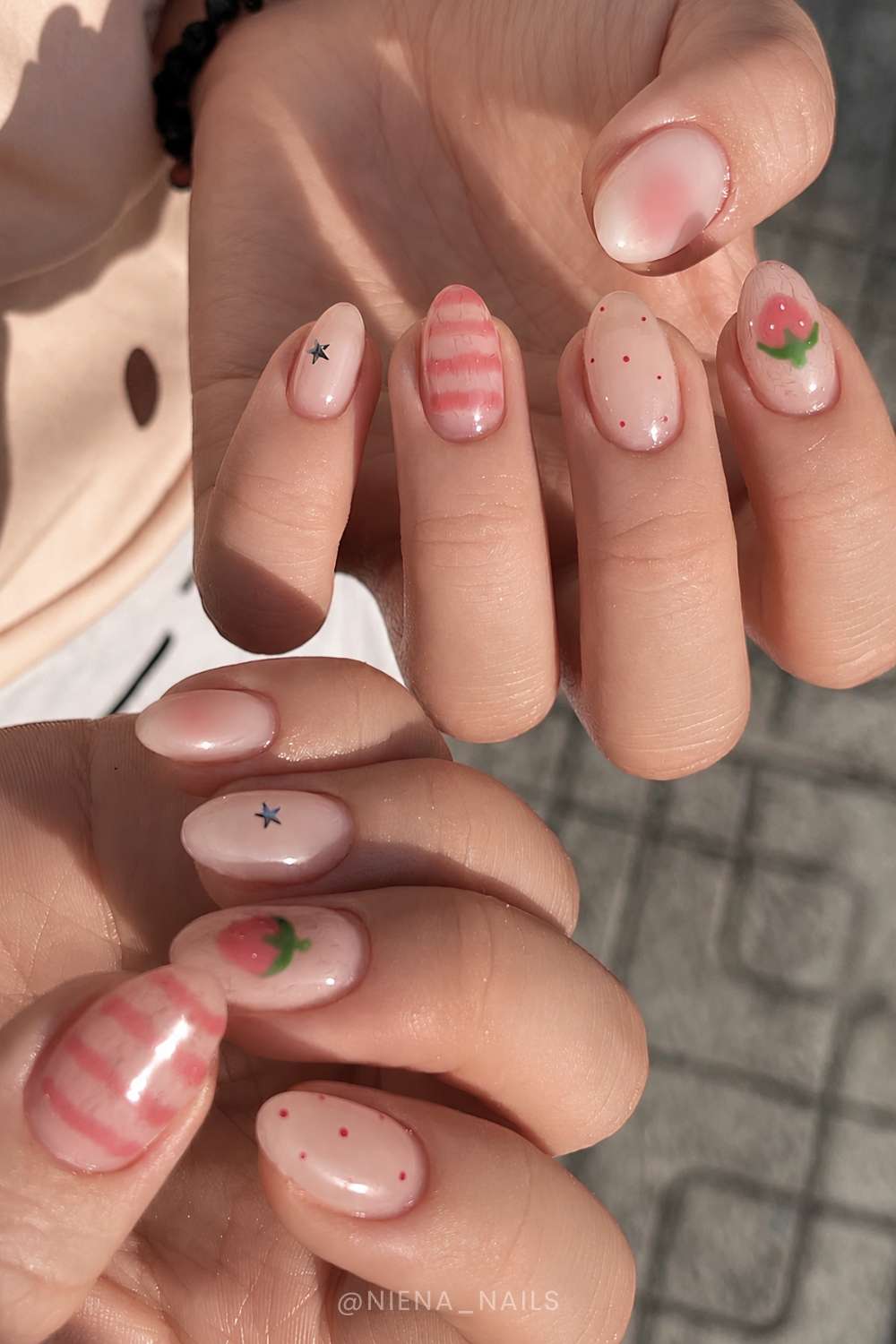 Milky jelly nails with strawberries and stripes