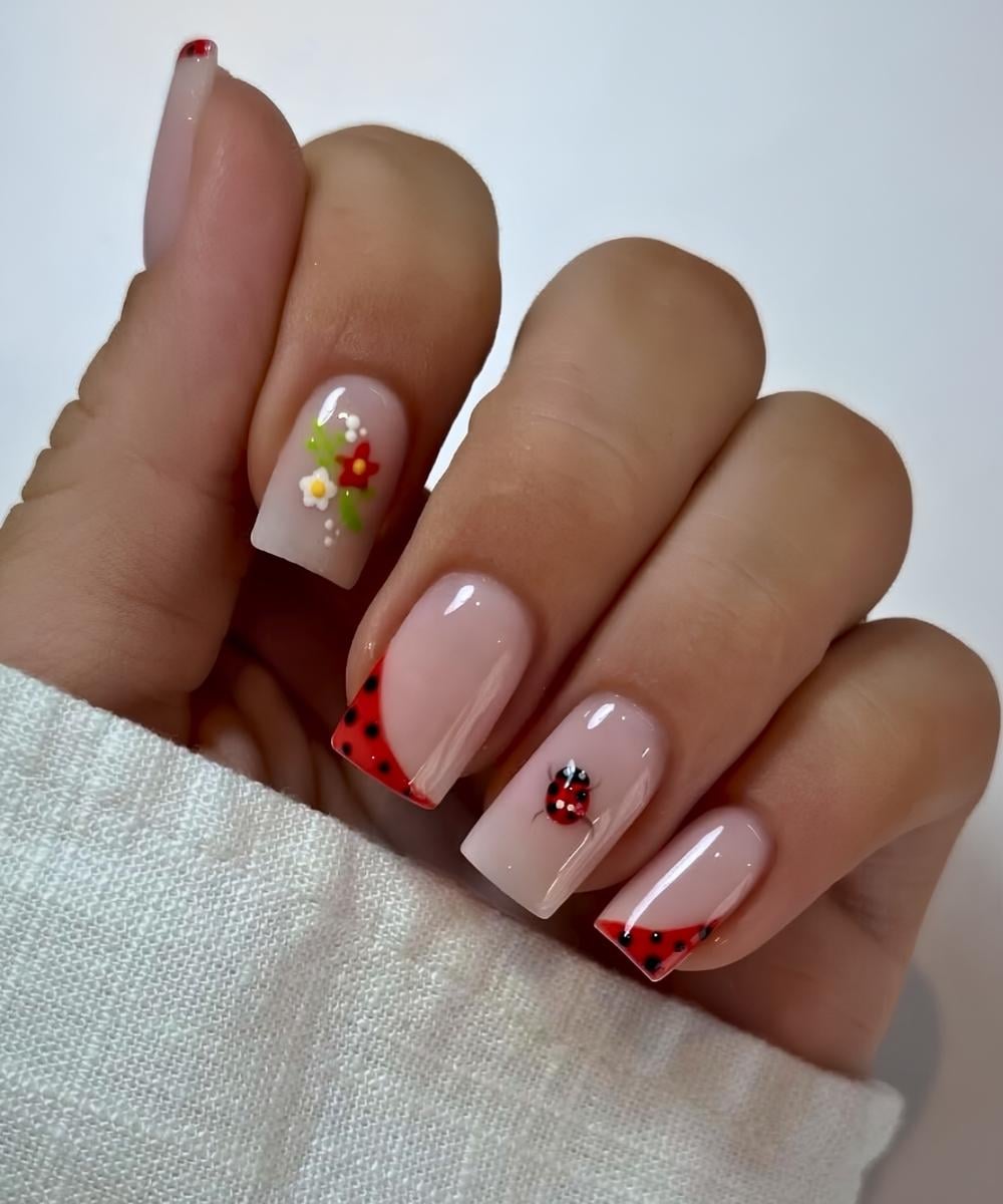 Milky nails with accent florals and ladybugs