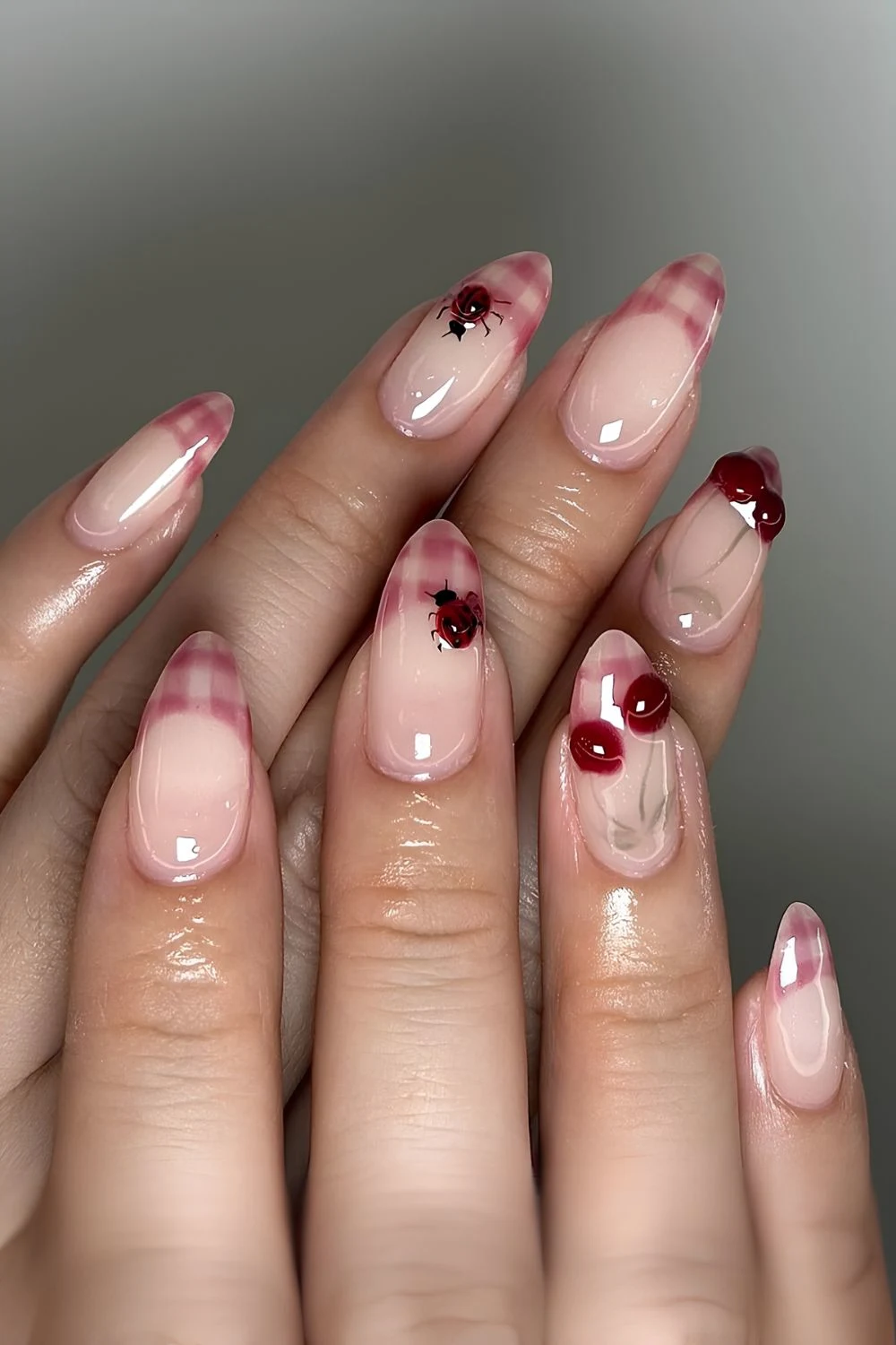 Milky pink and red gingham french tips with cherry and ladybugnail art