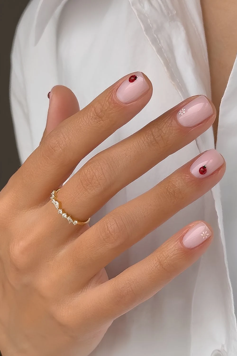 Milky pink nails with tiny 3d lady bug and flower accents