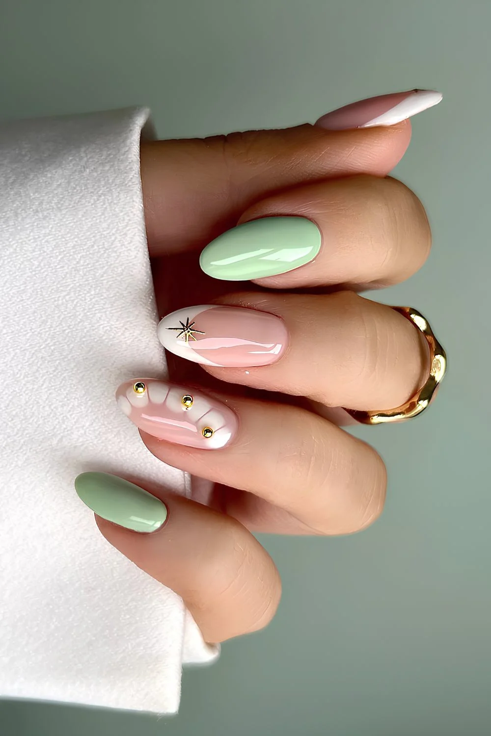 Mint green and white mani with animal print and gold details