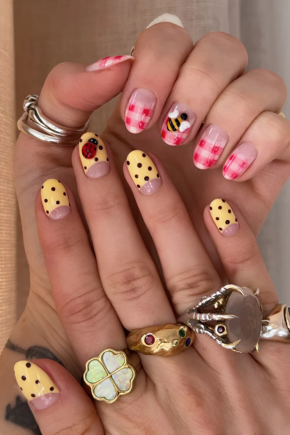 Mismatched gingham and polka dot nails with beetle accents