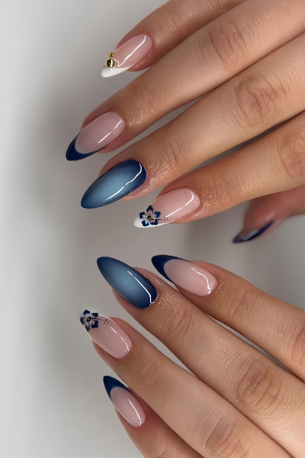 Navy blue mani with florals and aura effect with French tip accent