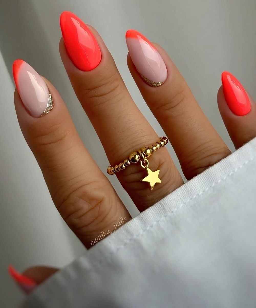 Neon coral nails with glitter details