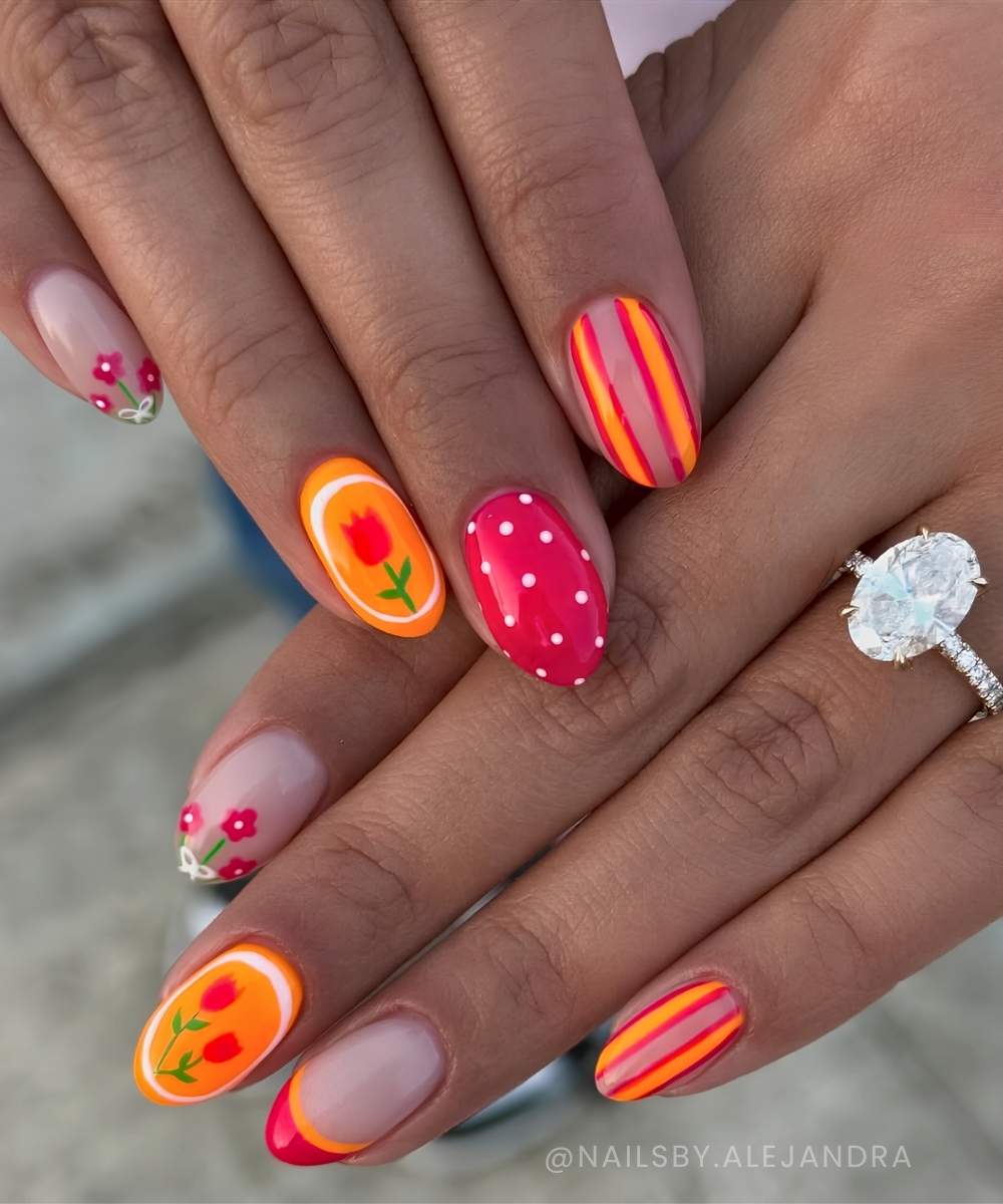 Neon pink and orange nails with flowers and stripes
