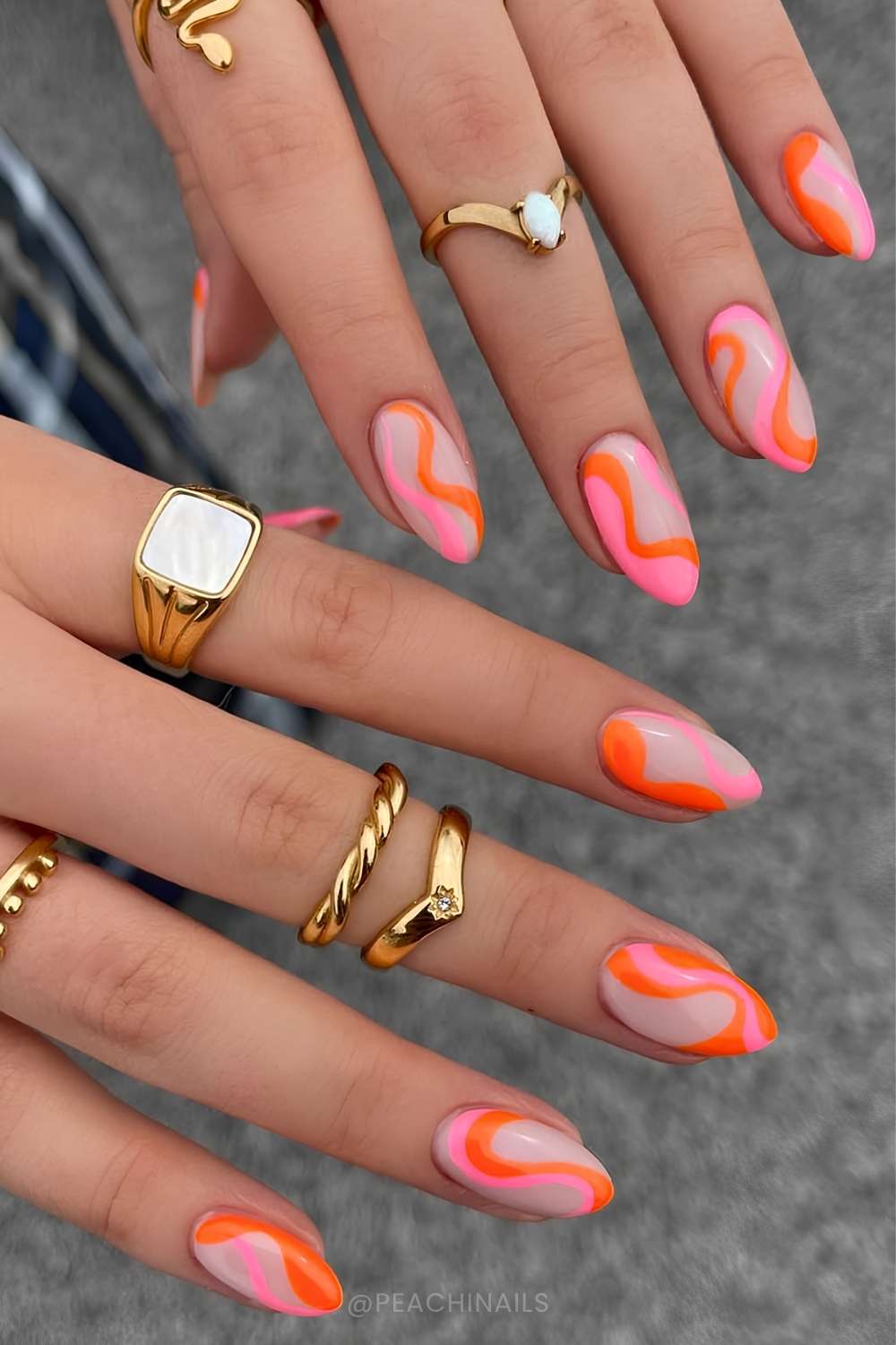 Neutral mani with pink and orange swirls