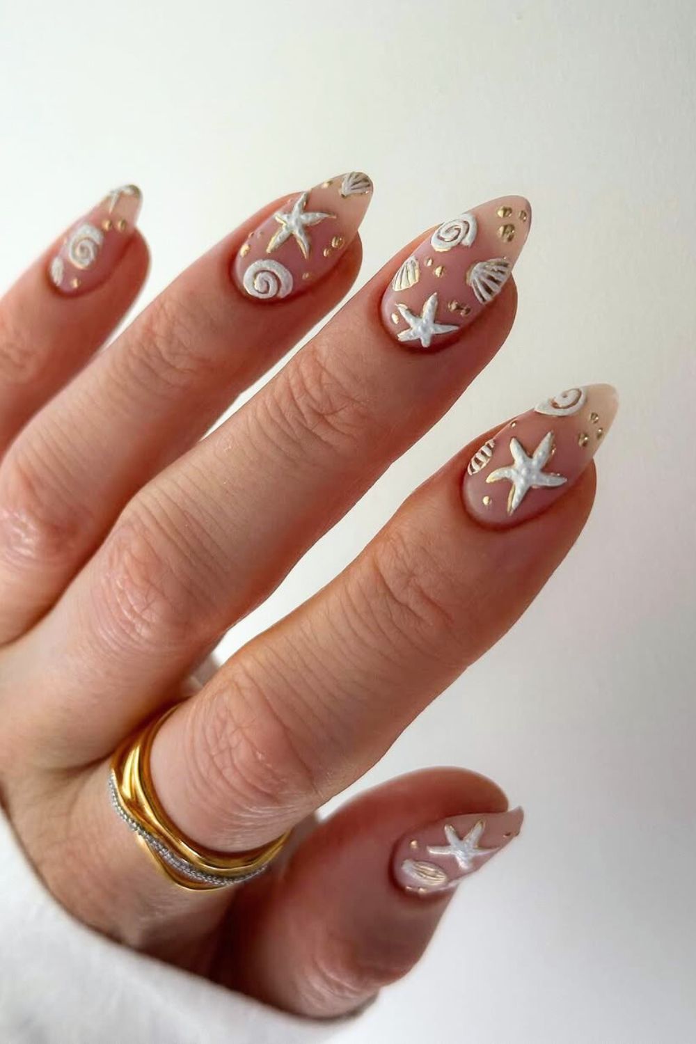 Neutral matte mani with seashells and gold dots