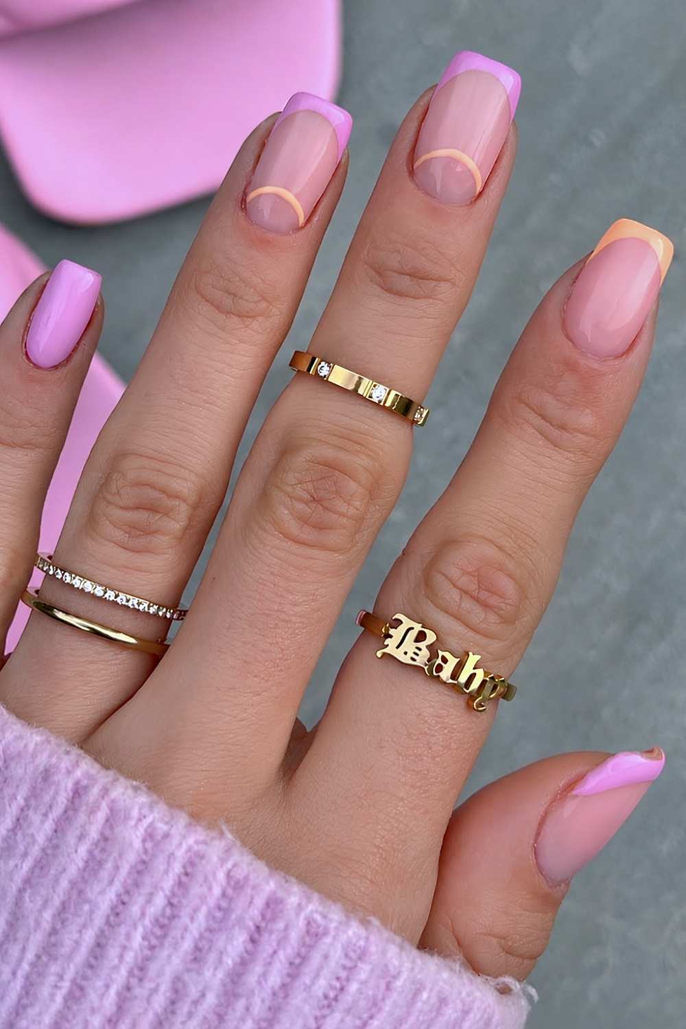 Orange and pink nails with half moon outlines