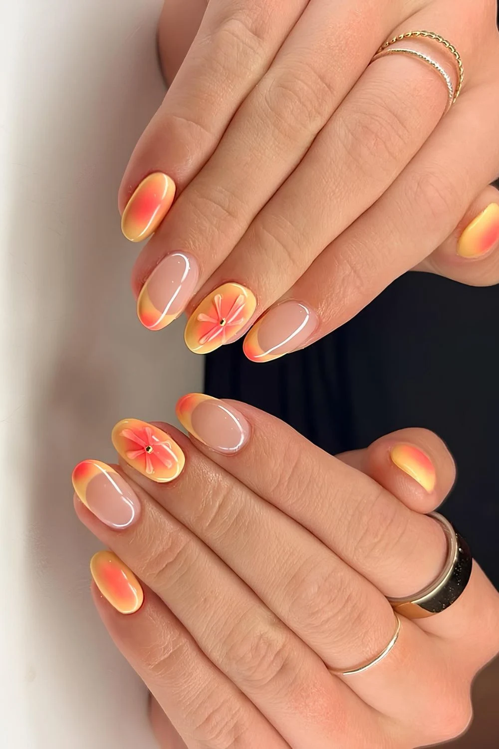 Orange and yellow French mani with aura effect and floral accent