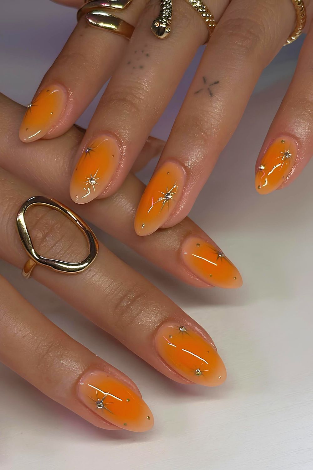 Orange aura mani with star accents