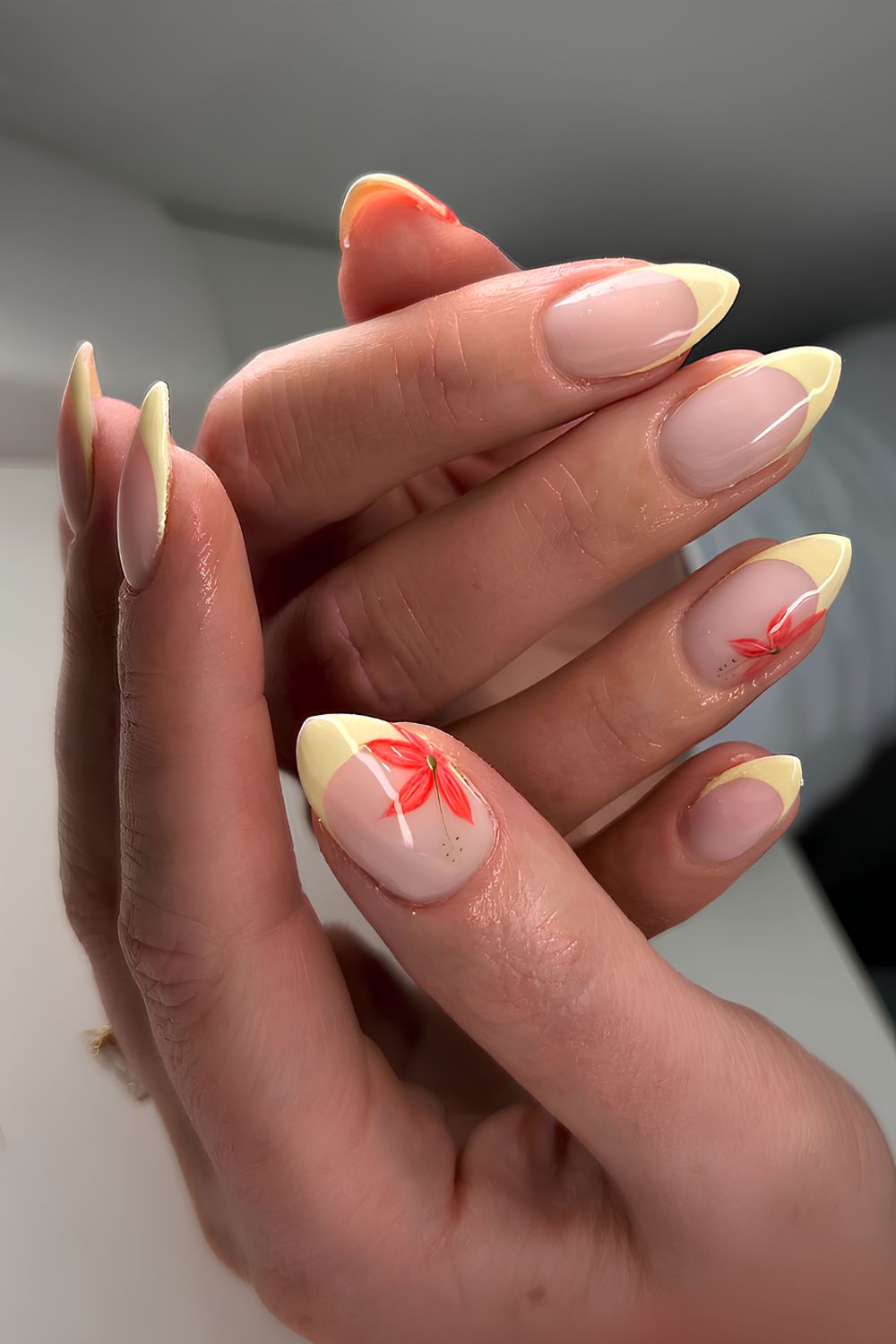 Pale yellow French mani with red flowers