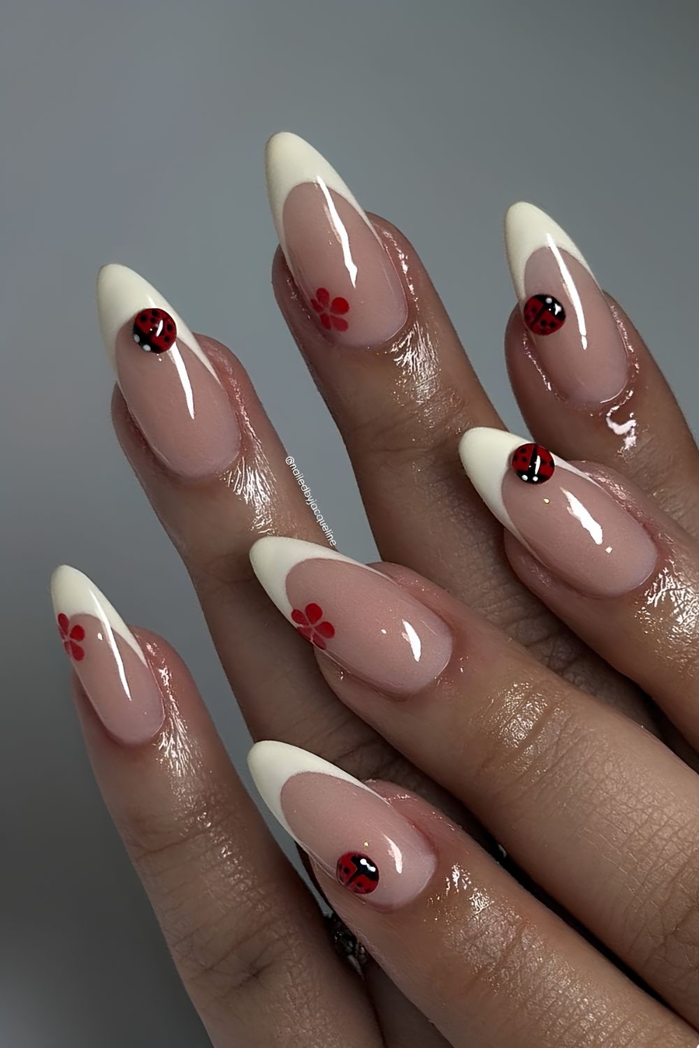 Pale yellow french tips with 3d ladybugs