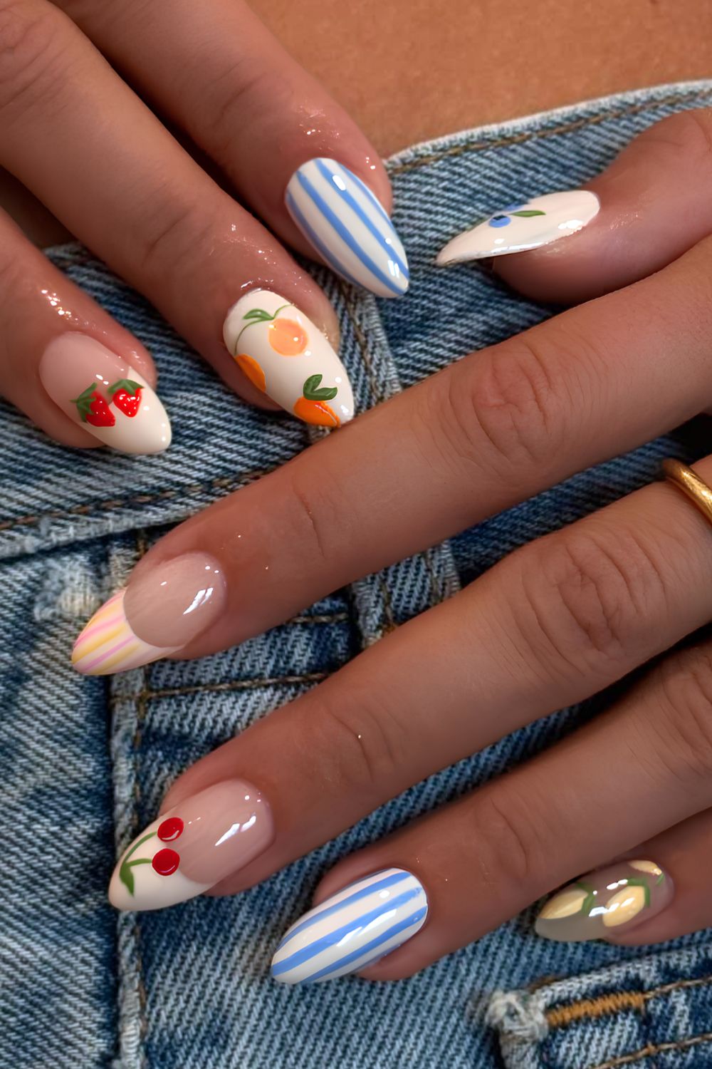 Pastel nails with fruit and stripe art