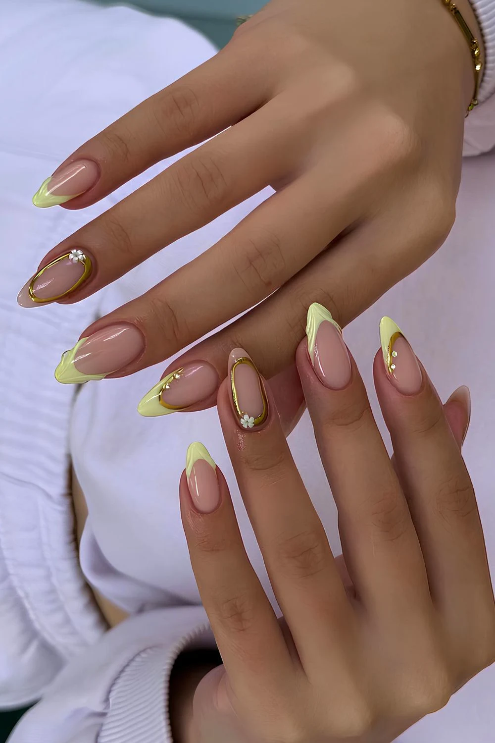 Pastel yellow French mani with gold chrome accents