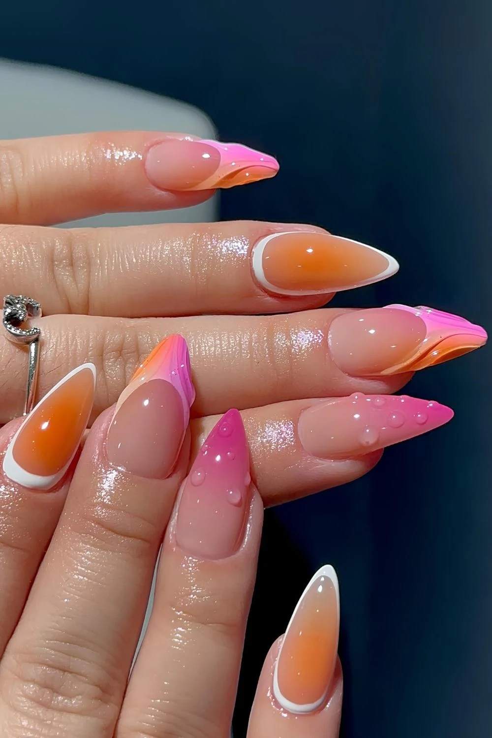 Pink and orange nails with mix and match design