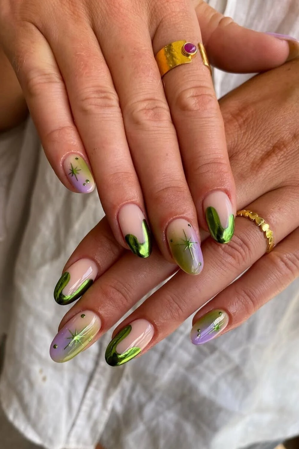 Purple and green mani with chrome and star accents