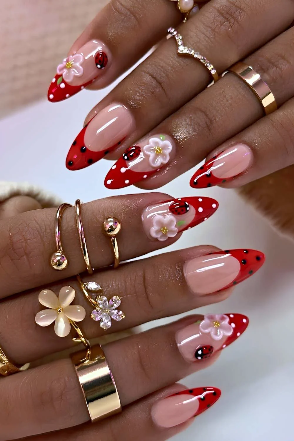 Red French mani with ladybug art